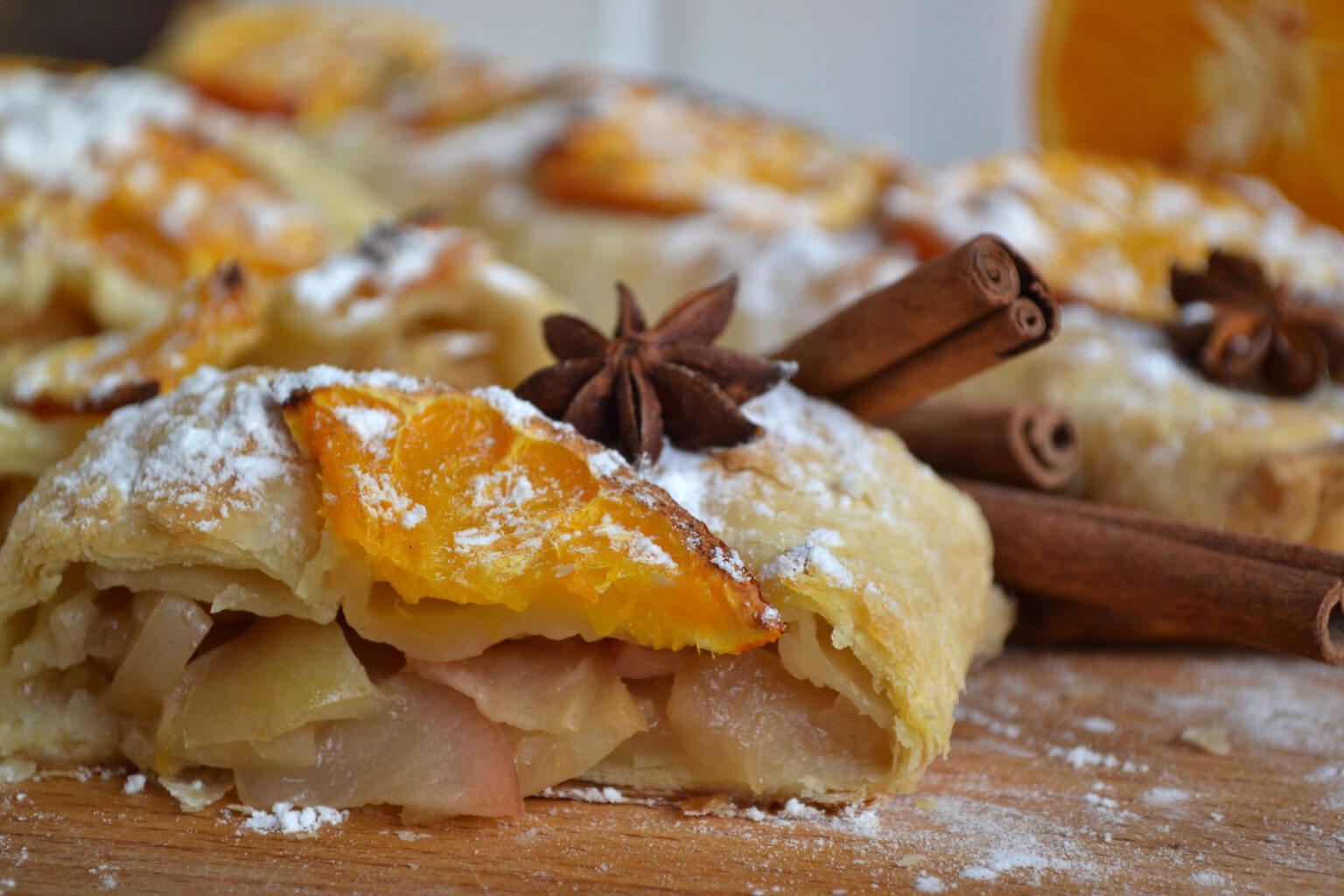 Apple strudel with orange slices and spices